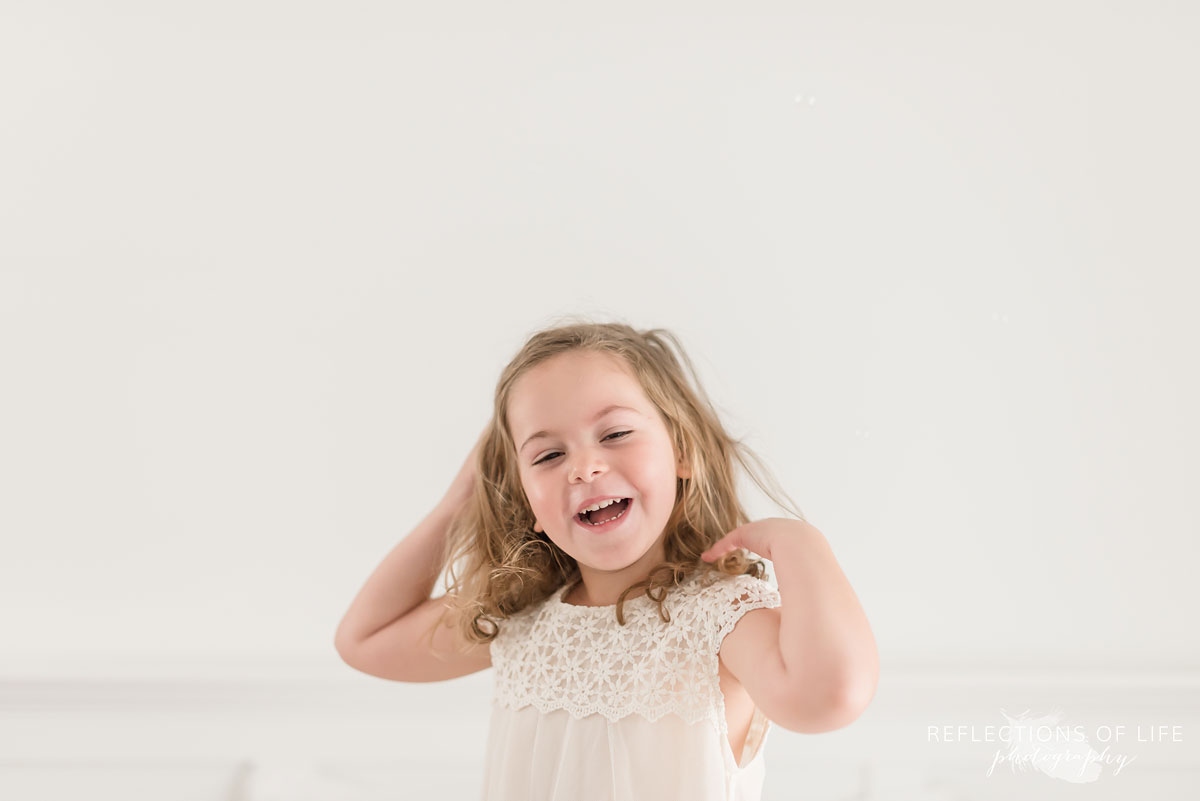 Little girl fixing her hair