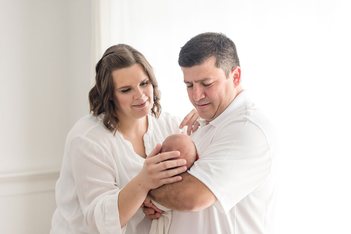 Baby Jaxon in the arms of his loving parents