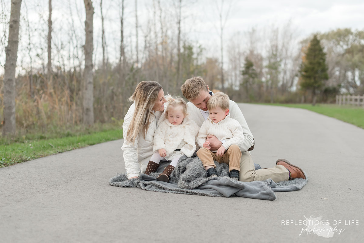 Family cuddling in fall of 2017 in Grimsby Ontario Canada