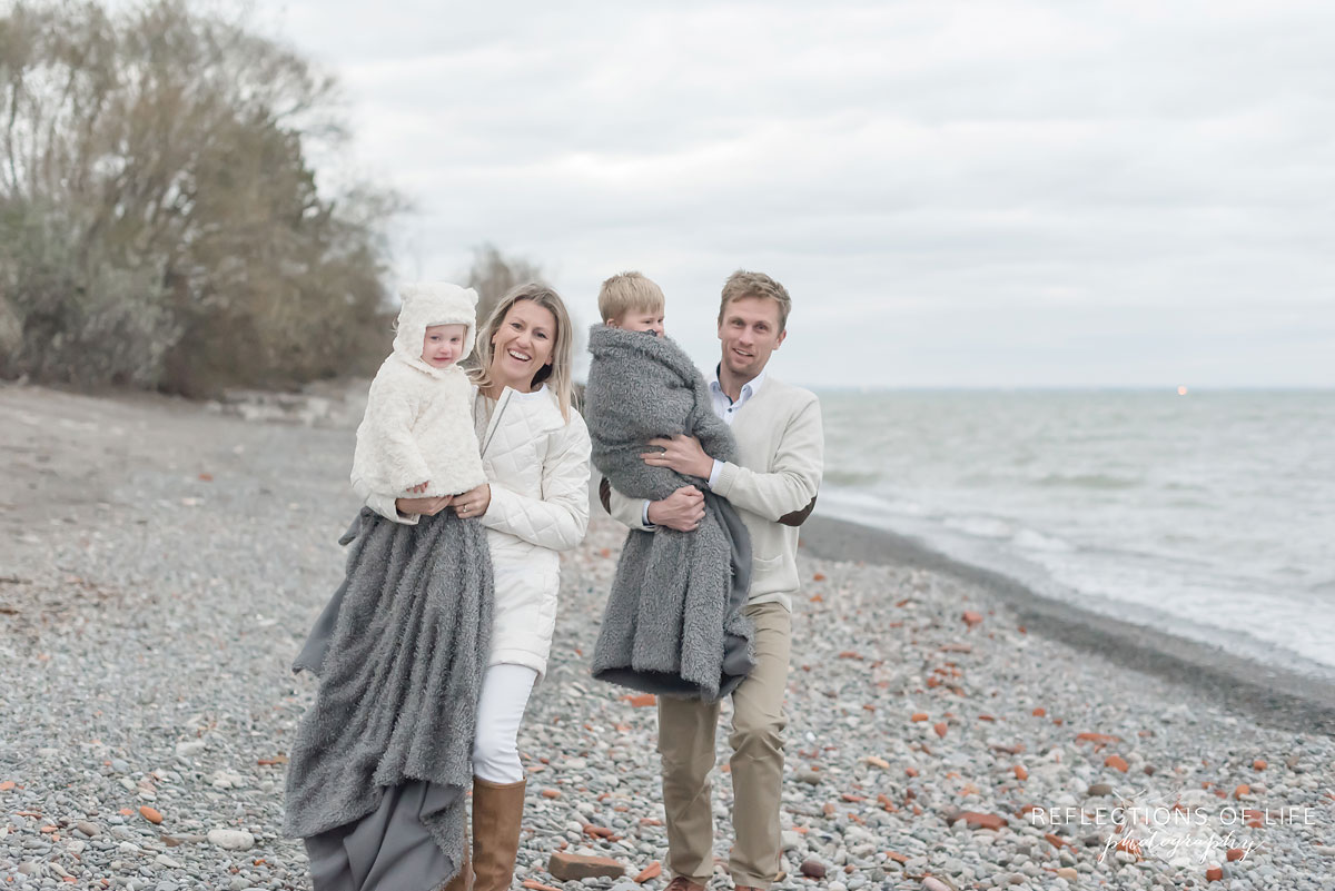 Family photos on the beach in winter in Ontario Canada