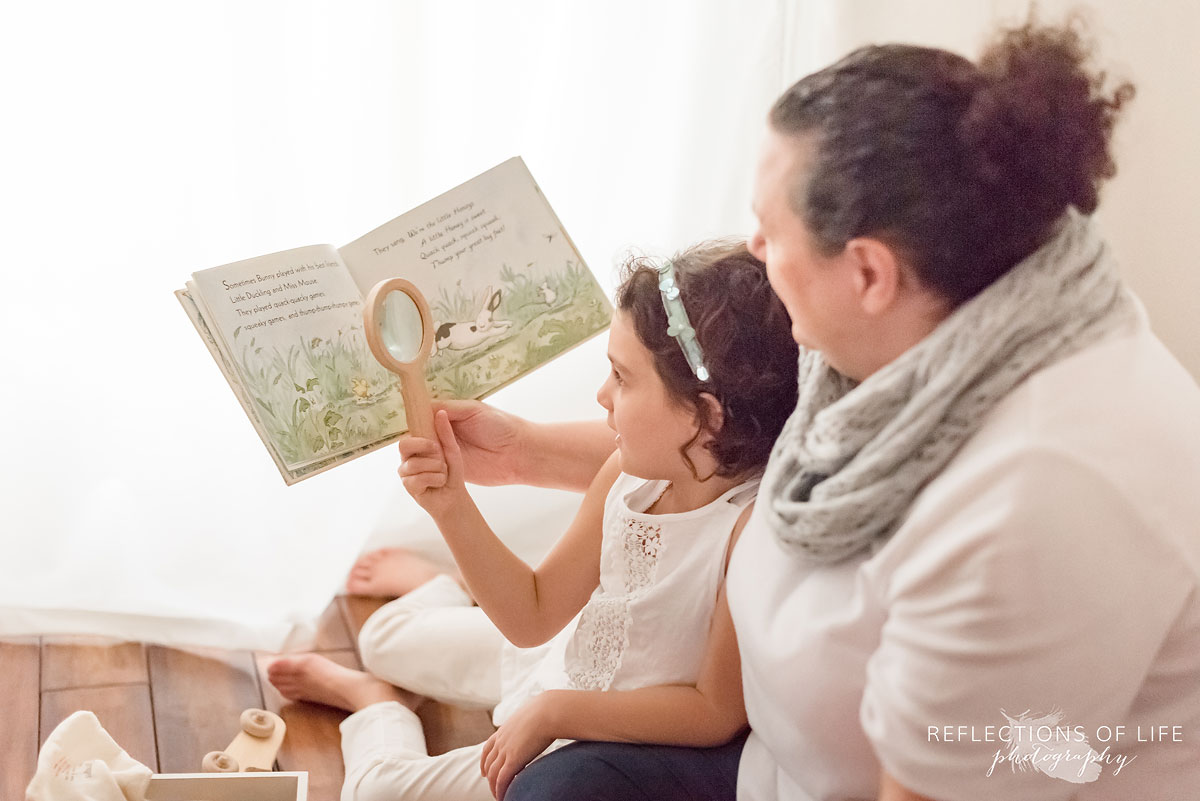 mother reading to daughter