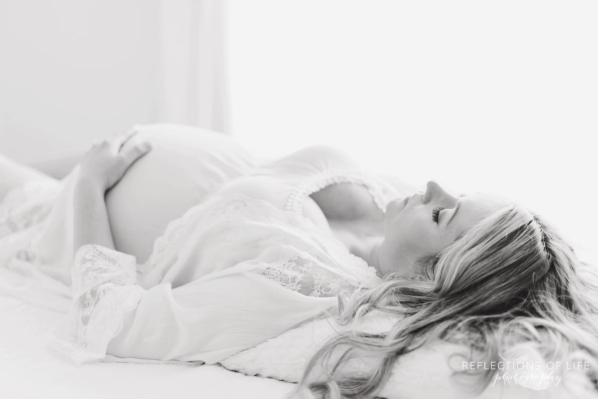 black and white woman hands on belly