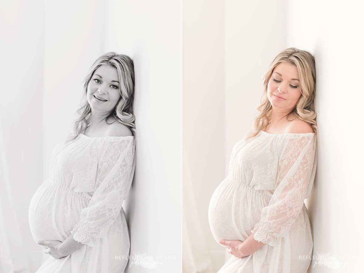 mother leaning against wall hands on belly