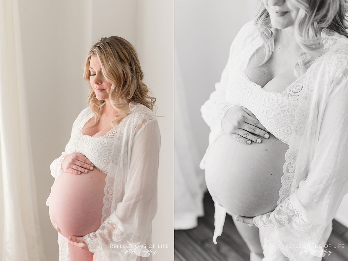 pregnant woman pink shirt hand on belly
