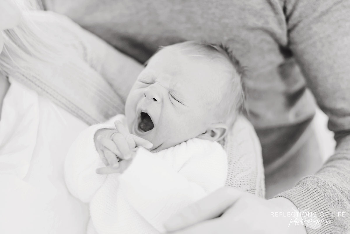 yawning newborn baby black and white