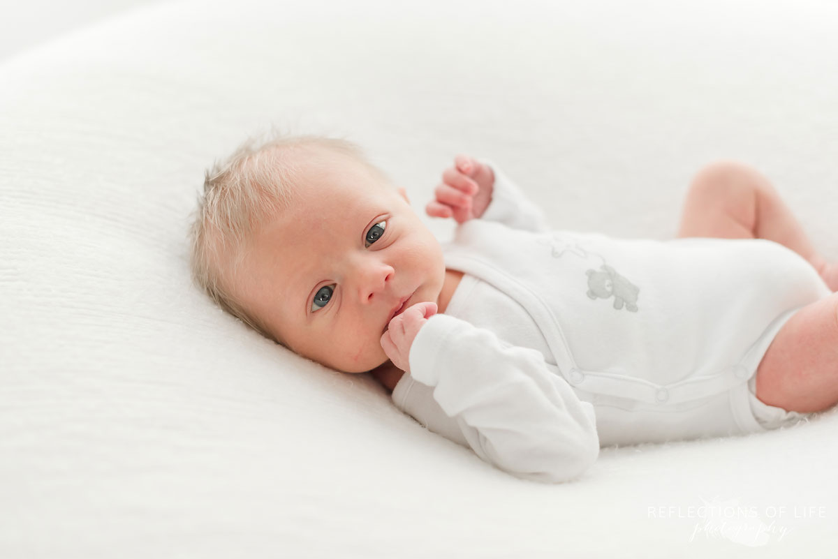 wide eyed newborn baby