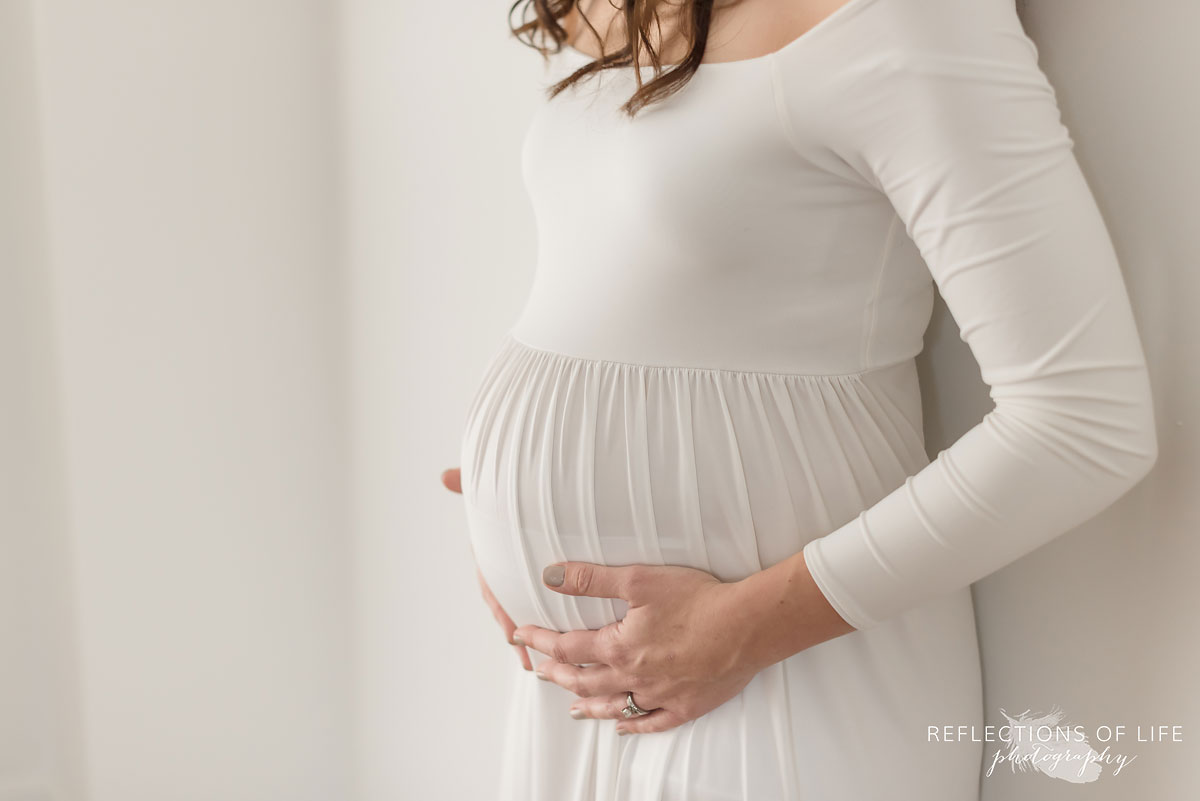 mother to be hands on stomach
