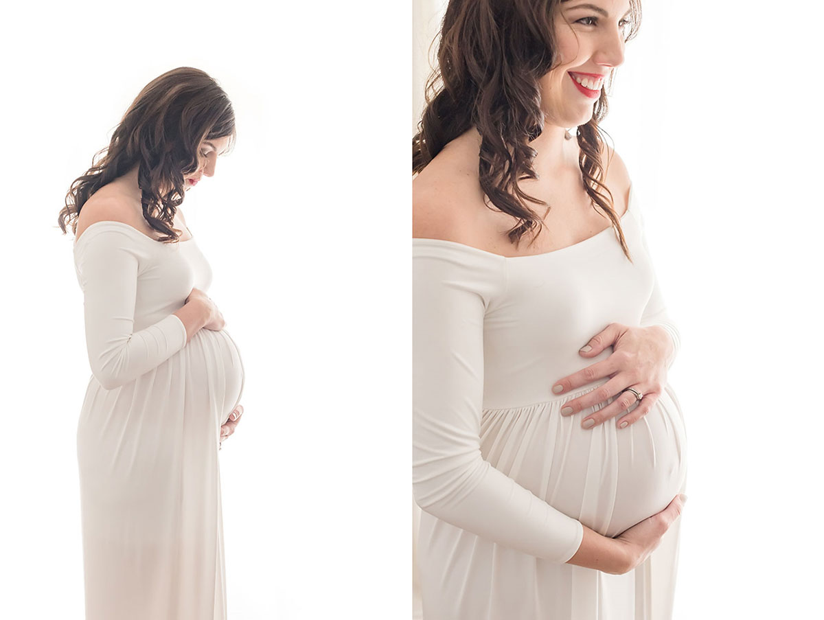pregnant mother smiling with hands on stomach