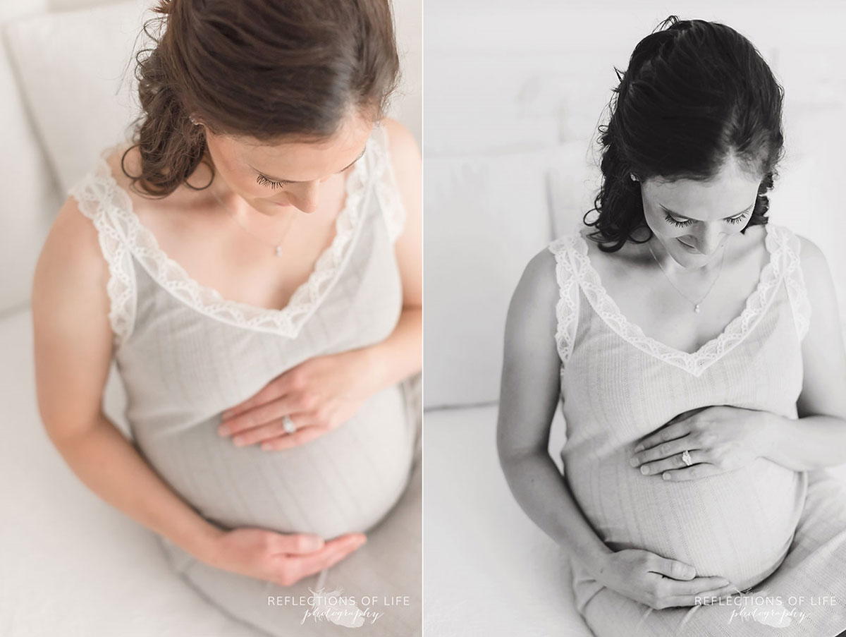 pregnant mom sitting on bed with hands on her belly