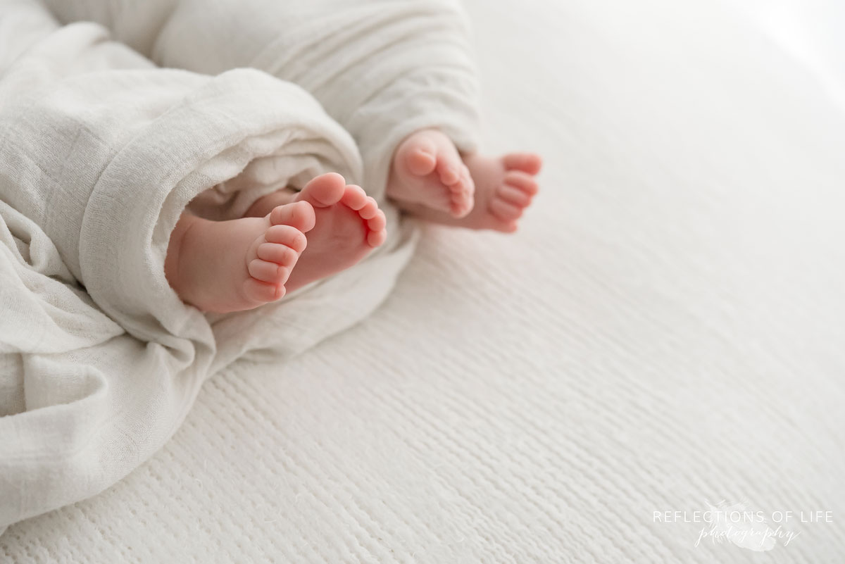 twin newborn baby girl feet