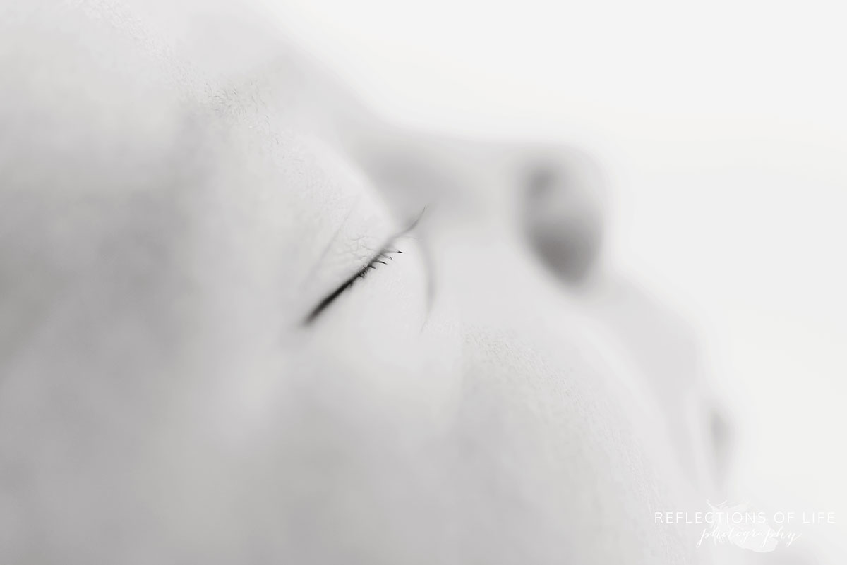 close up photo of newborn baby girl eyelashes