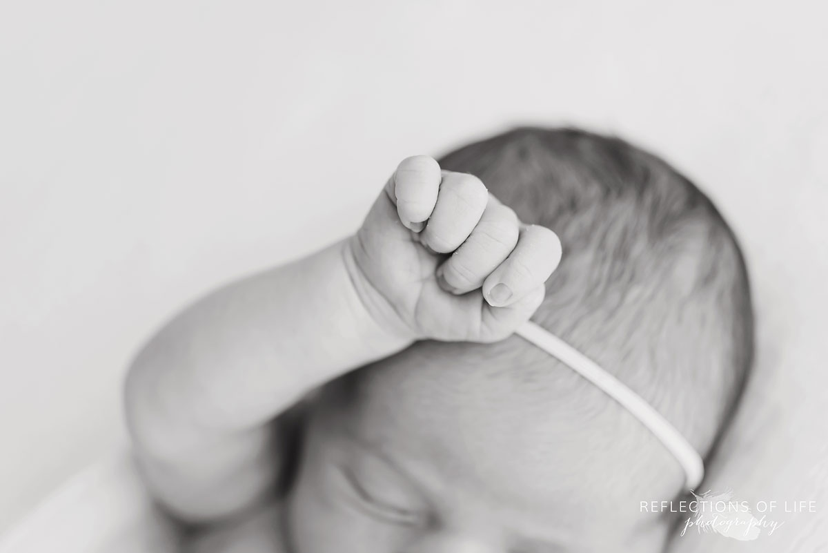 close up of newborn baby girl hand