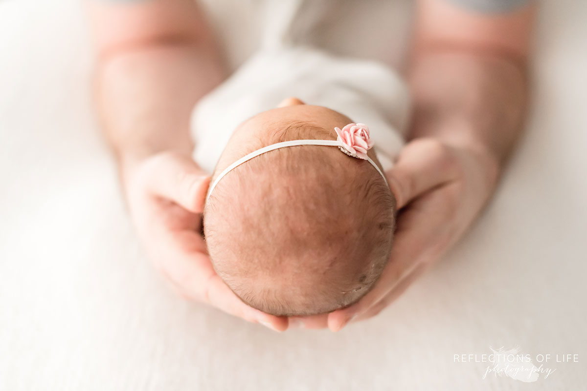 newborn baby girl head with headband