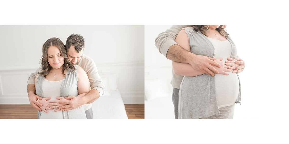 Mom and Dad hug over expecting baby