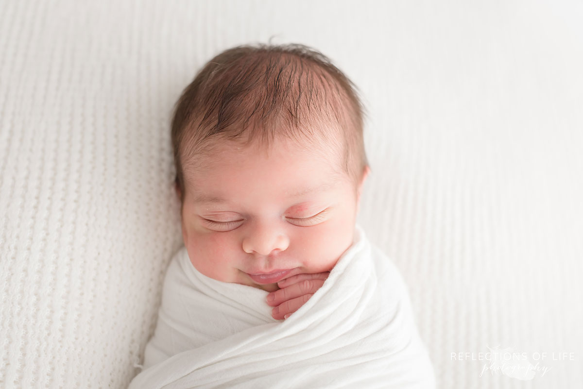 Baby girl calm and quiet at newborn baby session