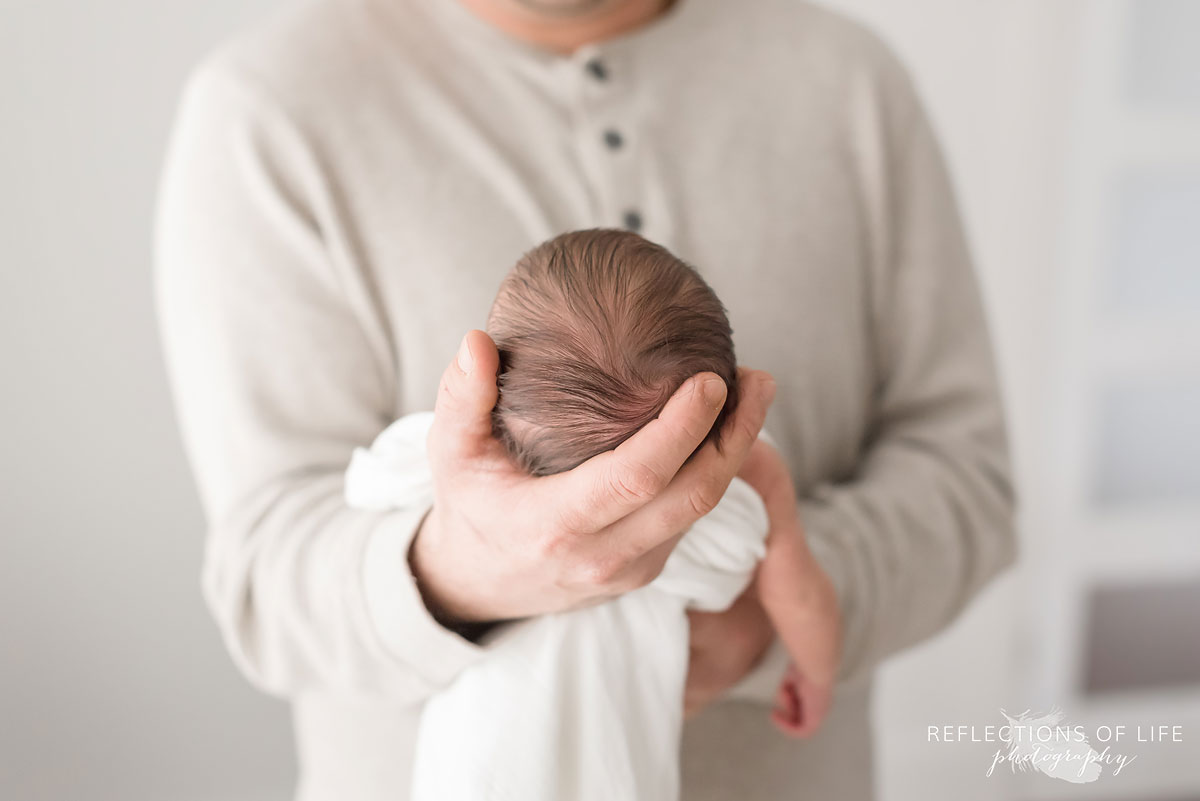 Daddy holding baby girl