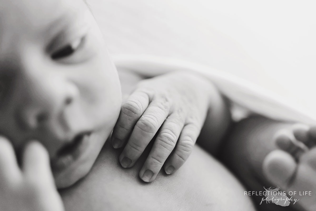 Newborn baby girl hands