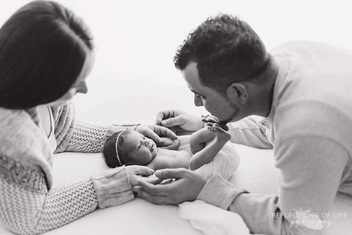 Famliy portrait with newborn baby girl in headband