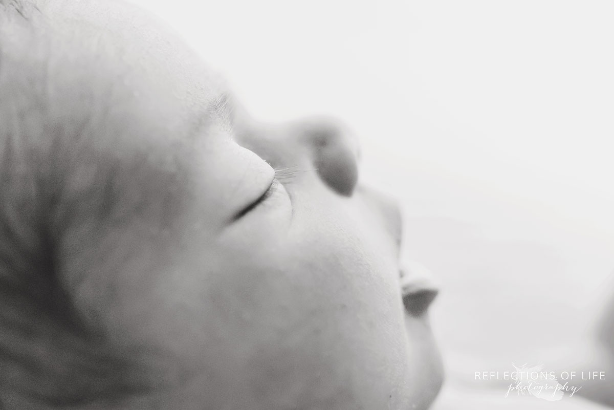 close up of newborn baby girl eyelashes