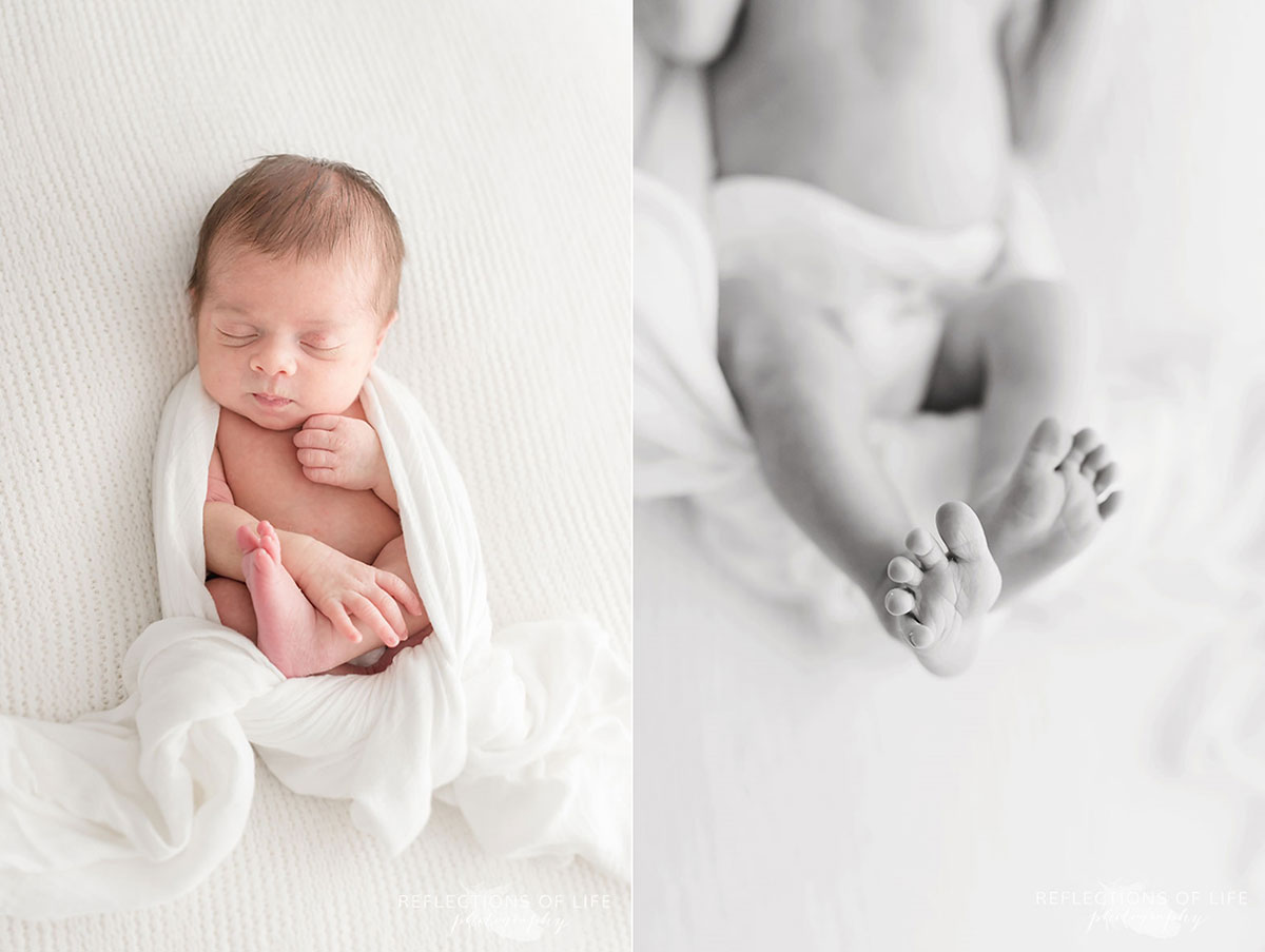 Newborn baby girl swaddled in white on white blanket