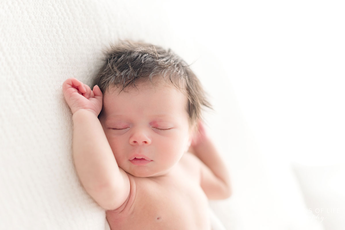 Newborn baby girl with a beautiful head of hair
