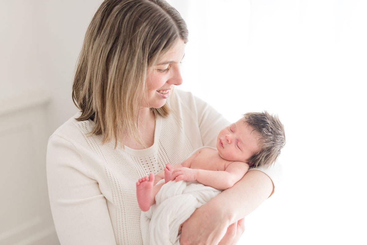 Baby girl in her mothers arms