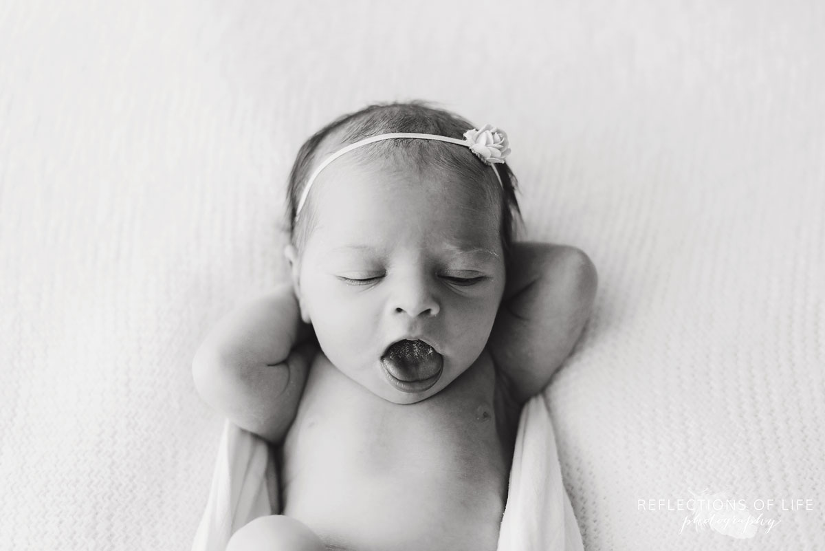 baby girl yawn in black and white