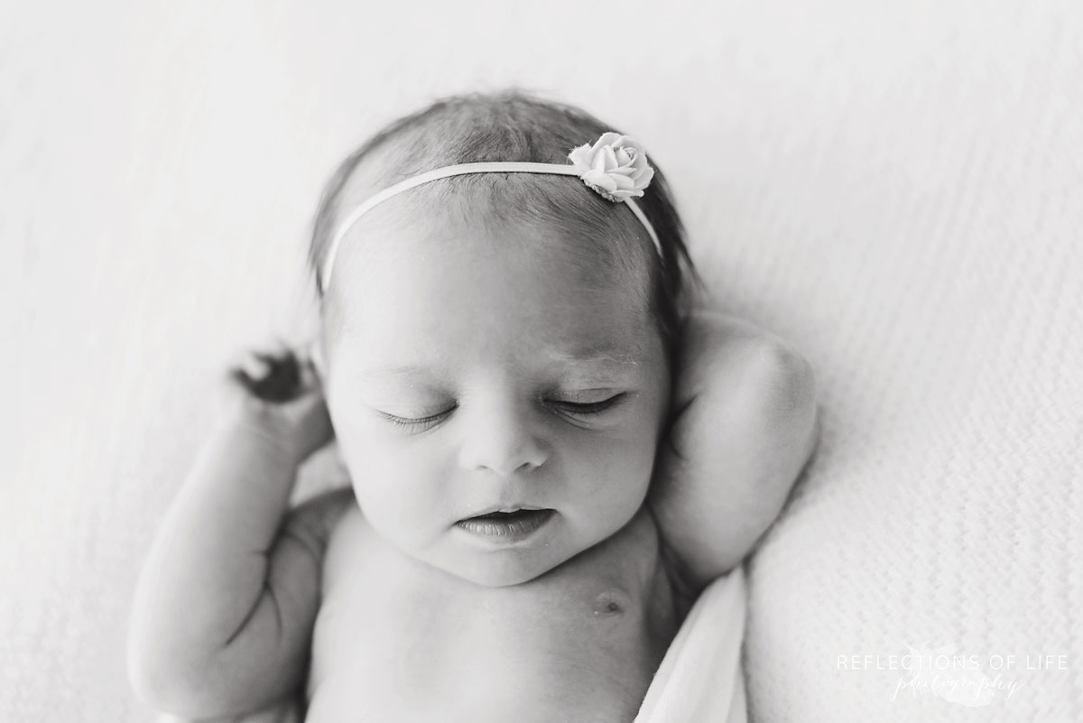 newborn baby girl portrait in black and white