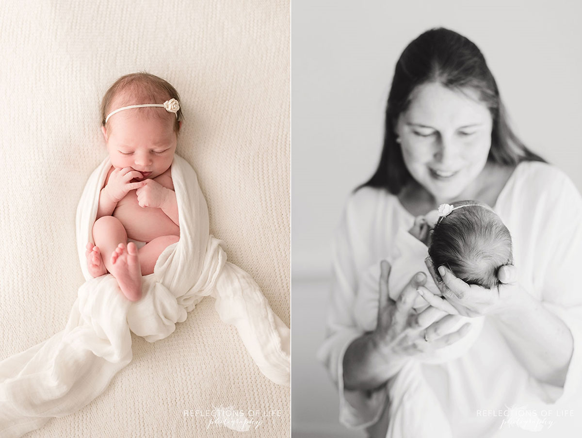 newborn baby girl wrapped in white and in mother's arms