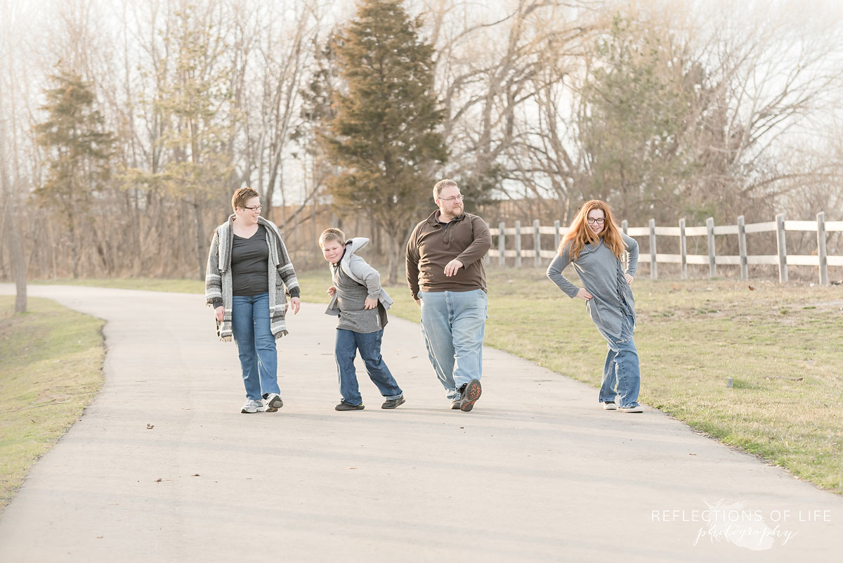 Family walking funny down a path