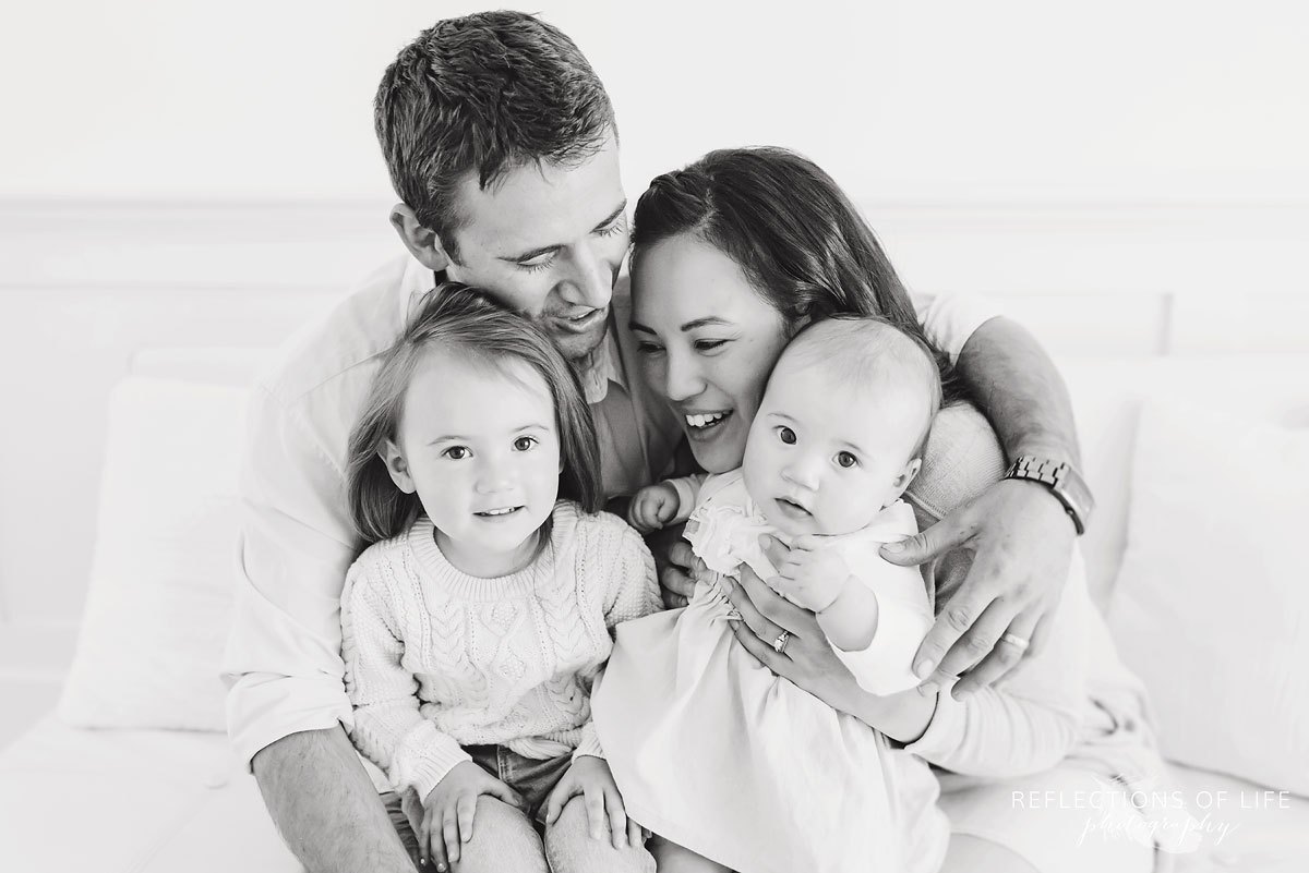 Black and white family on white couch