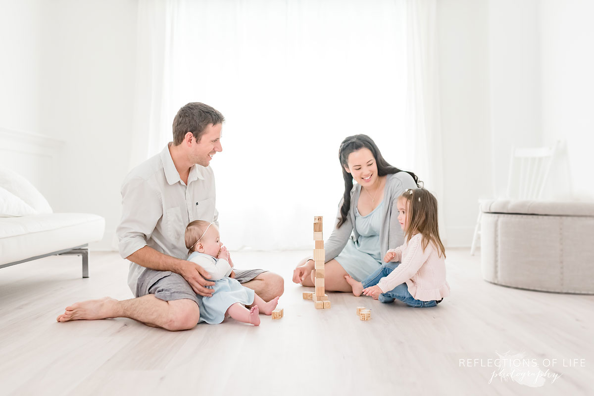 Candid family playing with building blocks in Grimsby Ontario
