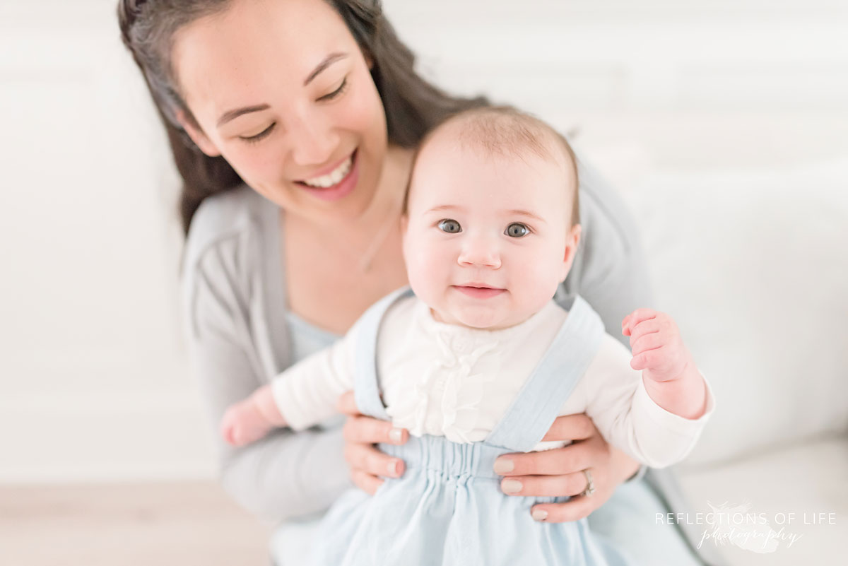 Mother and baby in white studio