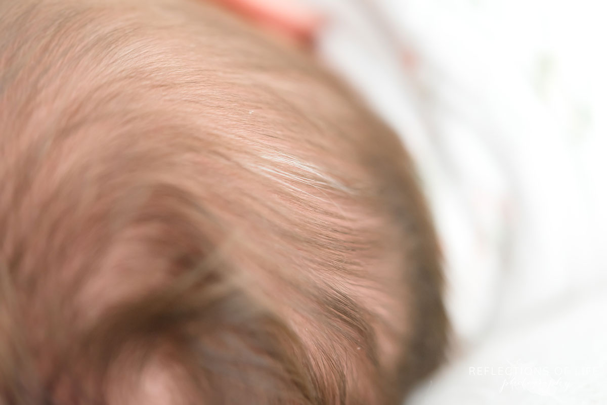Close up of baby girls little white hair
