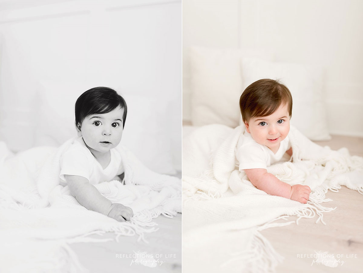 Baby on white blanket in white studio