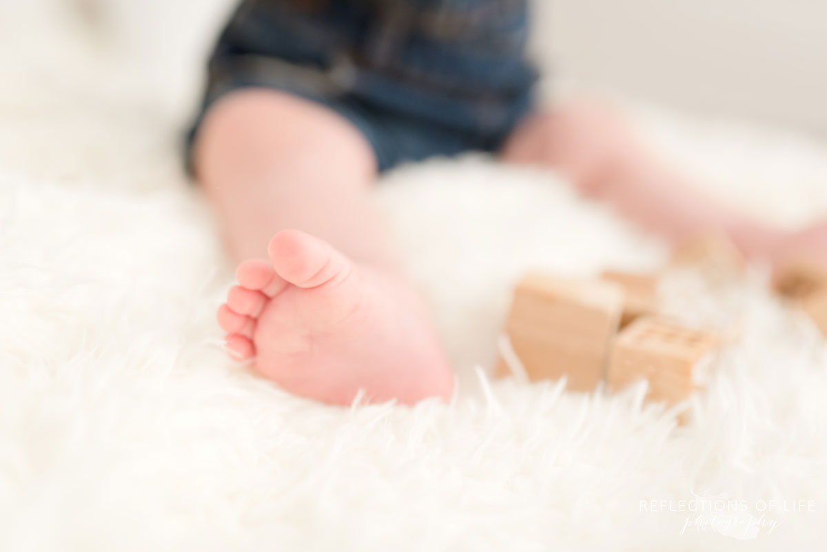Baby toes by wooden blocks in Grimsby Ontario