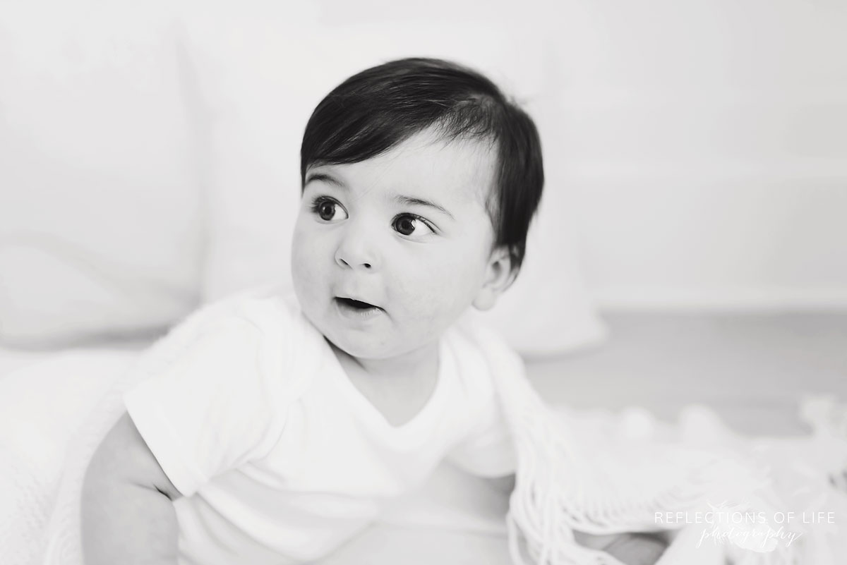 Baby looking away black and white