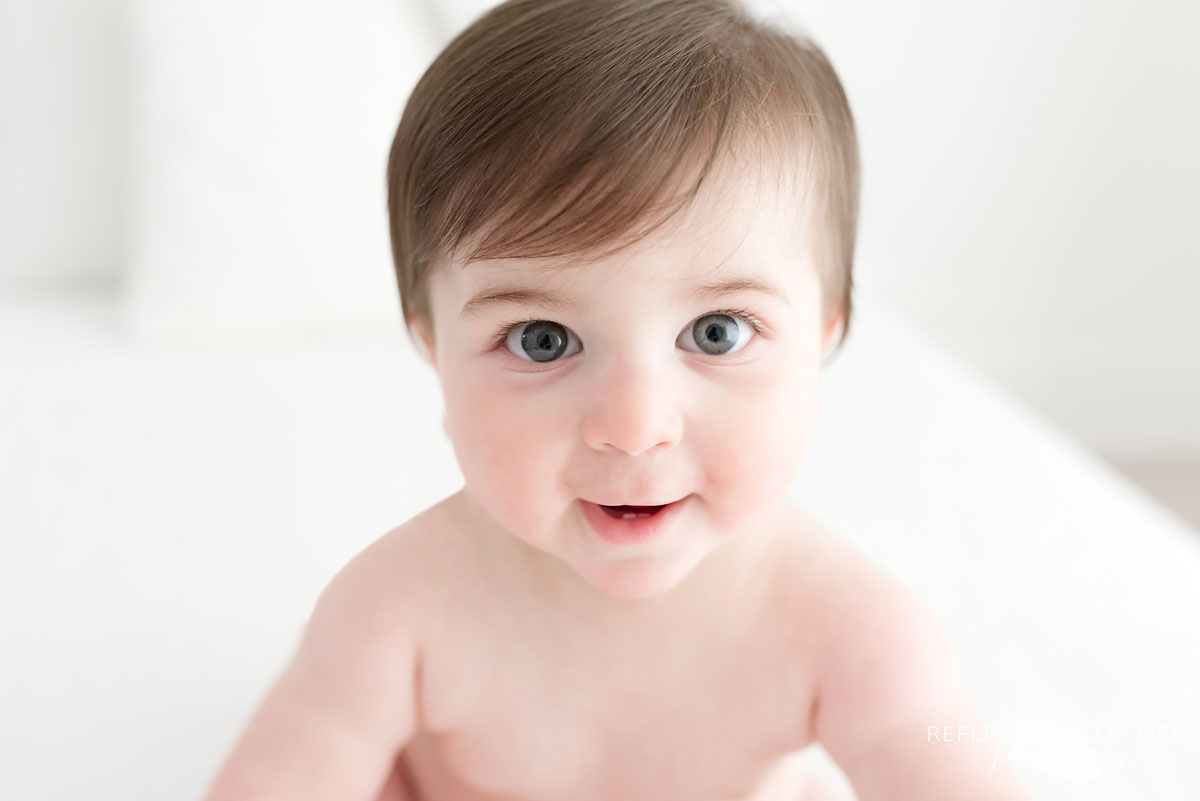 Baby looking at camera in white studio Grimsby Ontario