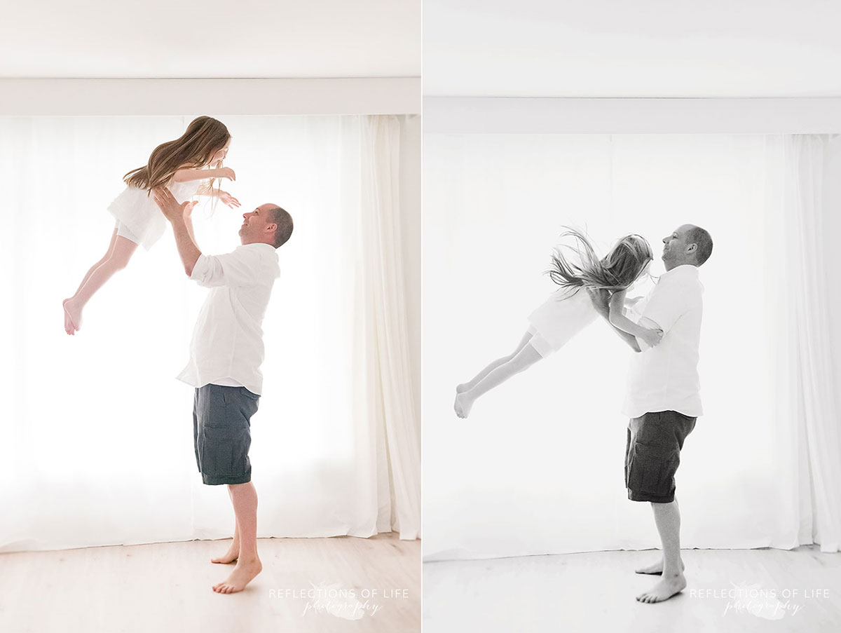 father and daughter playing together in studio