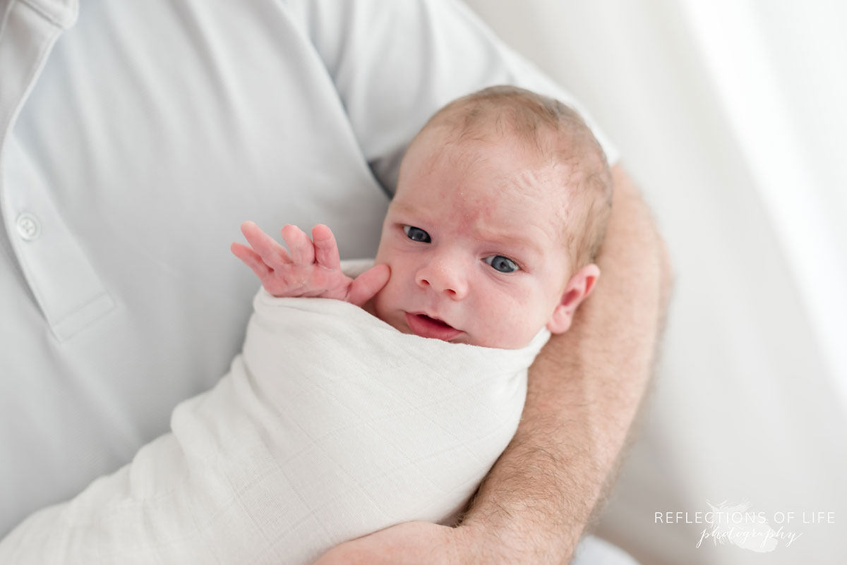 portrait of baby boy wrapped in blanket