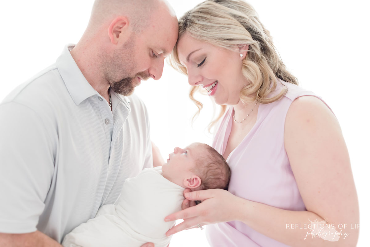 family in studio parents and baby