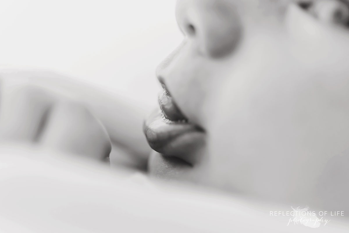 closeup of newborn baby lips black and white
