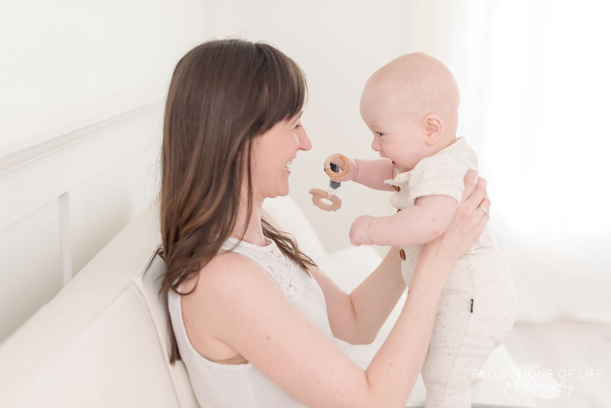 mom and baby smiling in studio.jpg
