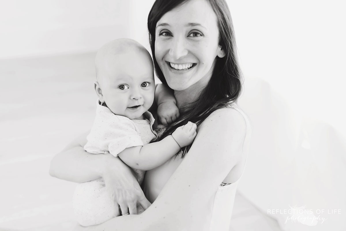 black and white portrait of mom holding baby.jpg