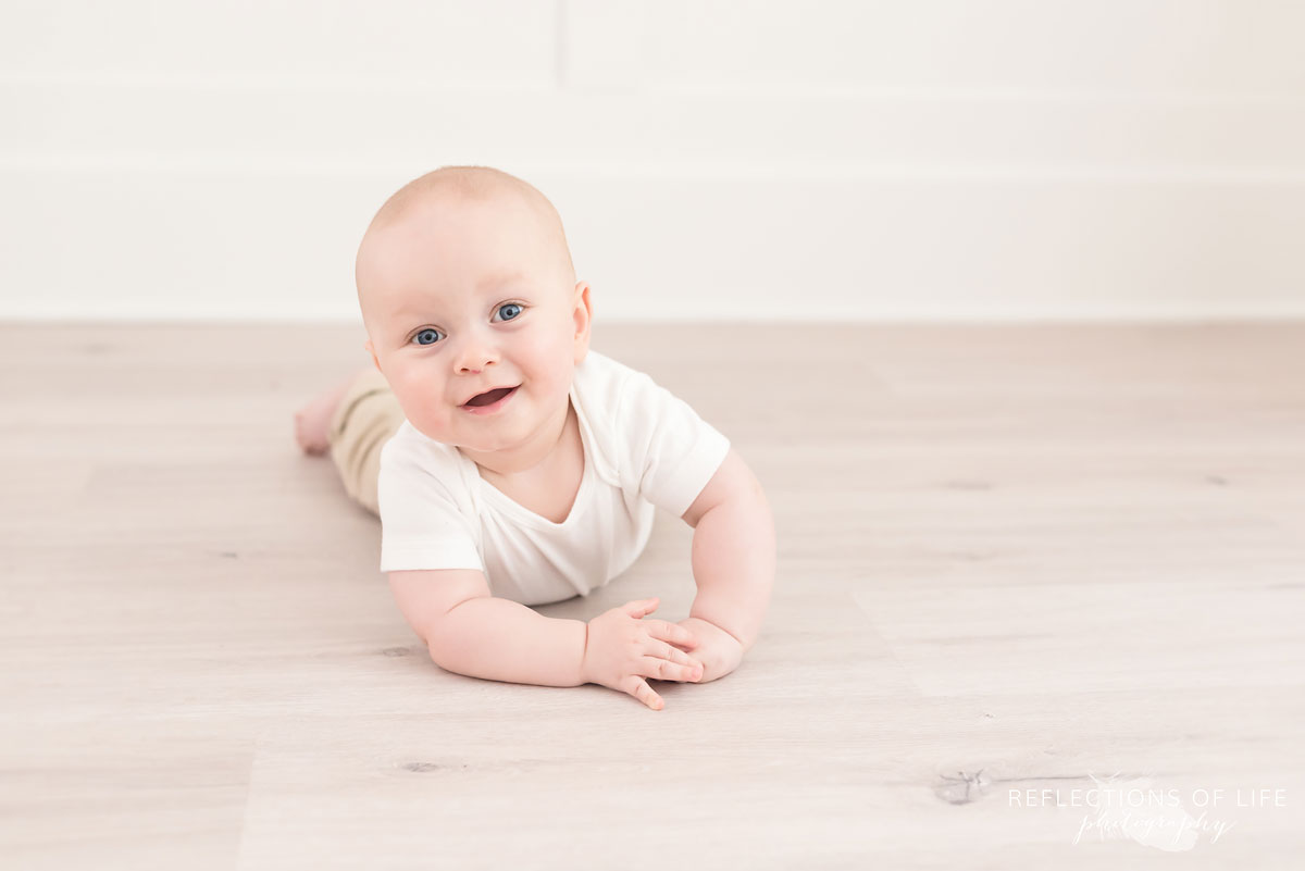 baby laying on floor in studio.jpg