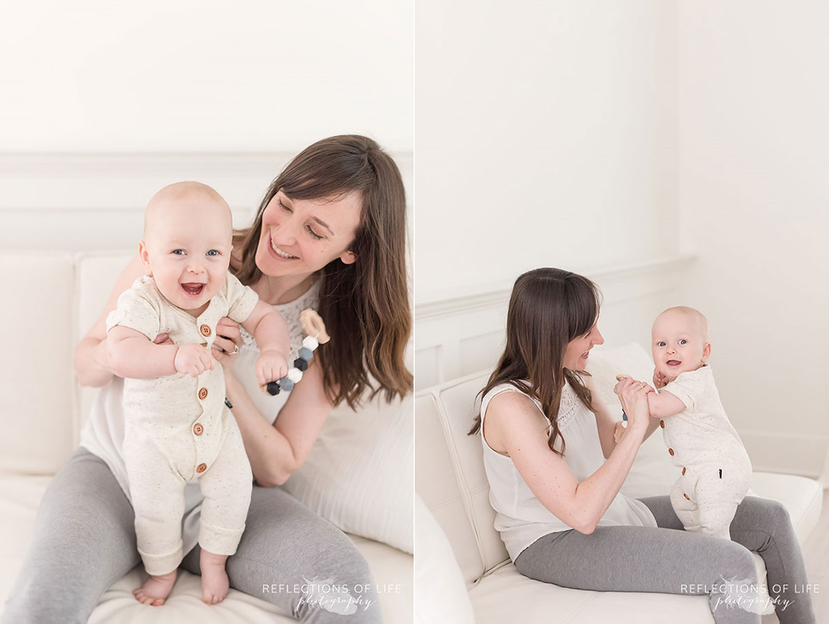 mother sitting on couch in studio holding baby boy.jpg