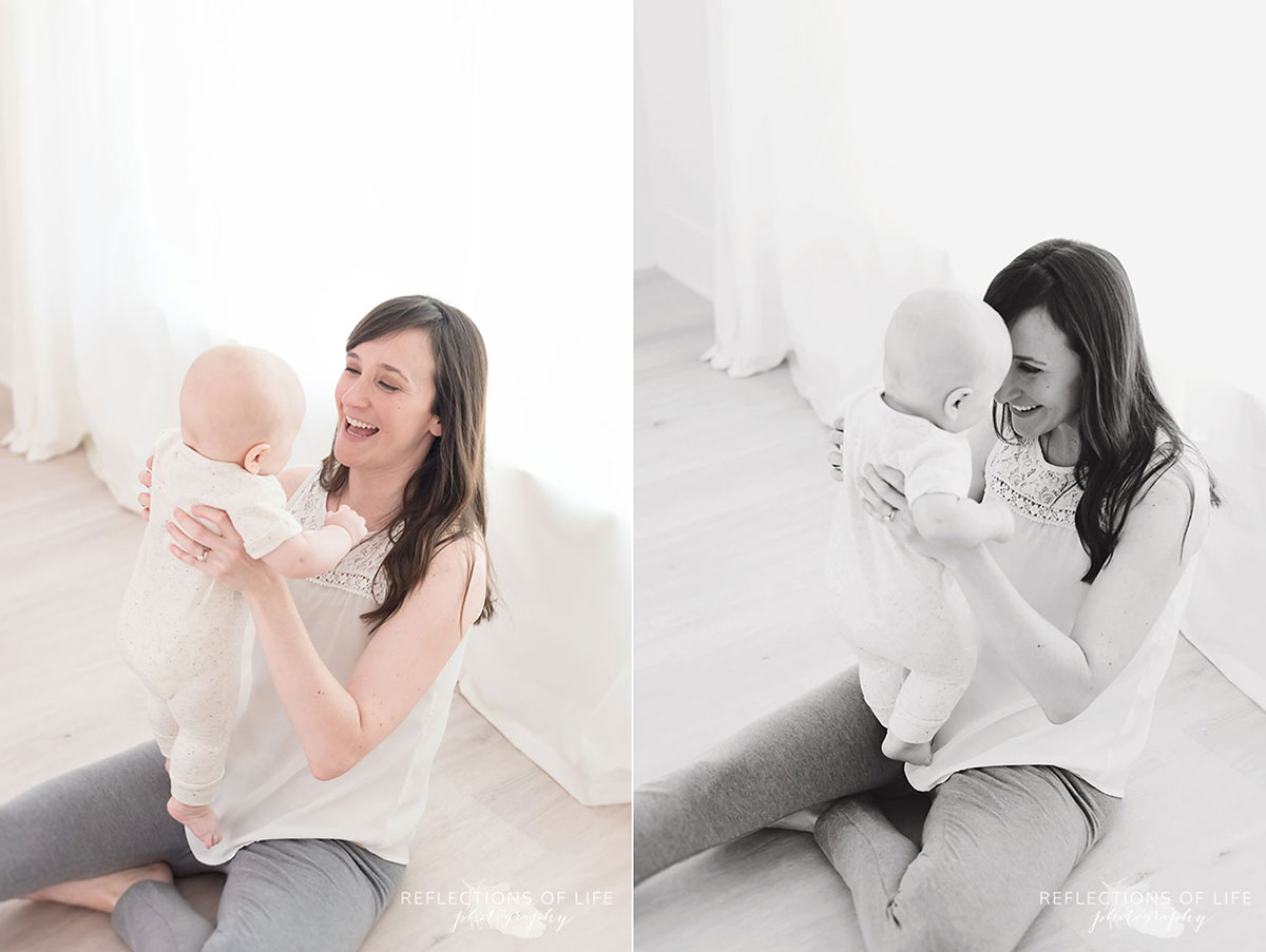 mother and baby on studio floor looking at each other.jpg