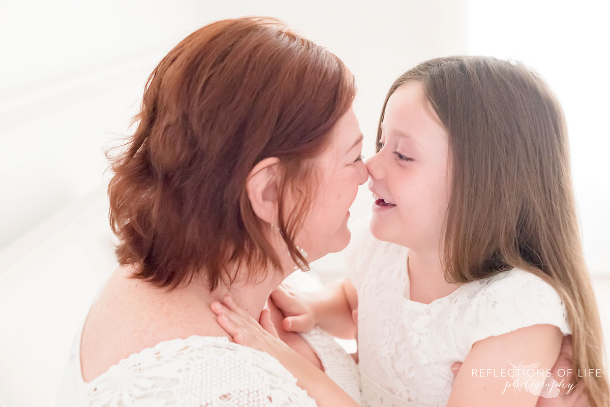 Portrait of Grandma and grandchild rubbing noses