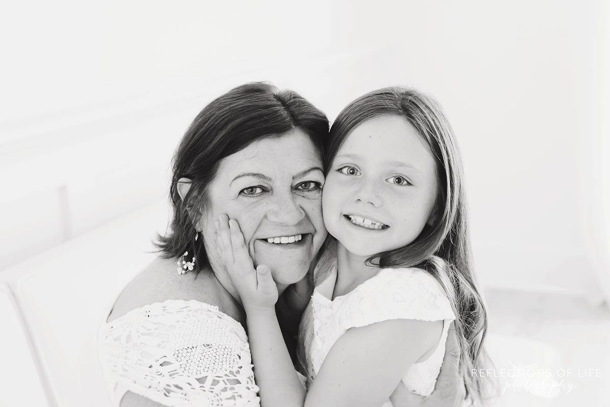 Portrait of Grandma and grandchild smiling at the camera