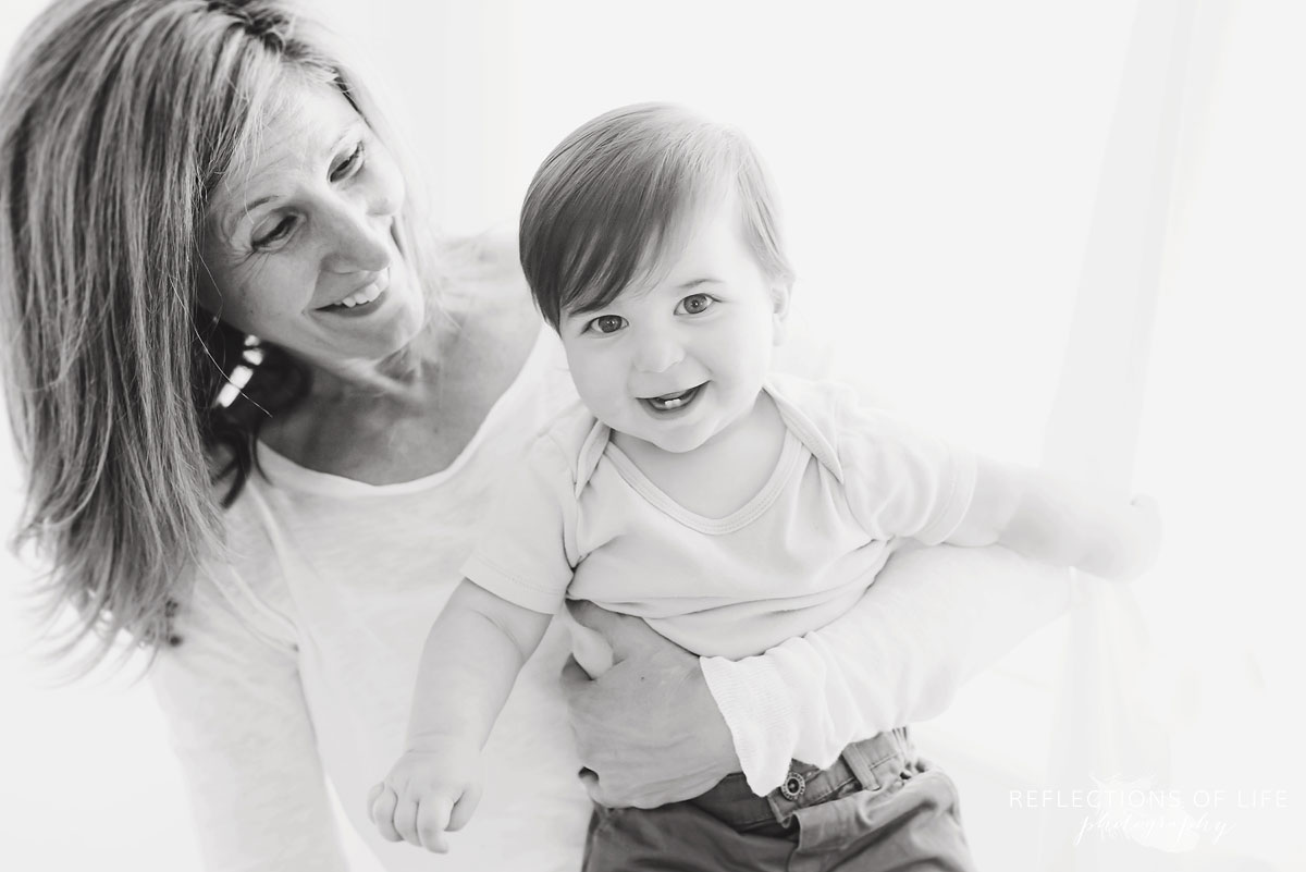 Grandma laughing with grandson in black and white
